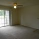 living room with sliding doors to balcony and storage closet
