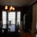 formal dining room with chair rail and crown moldings with bay window