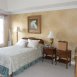 master bedroom with tray ceiling